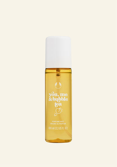 Yellow bottle with white cap on a beige background